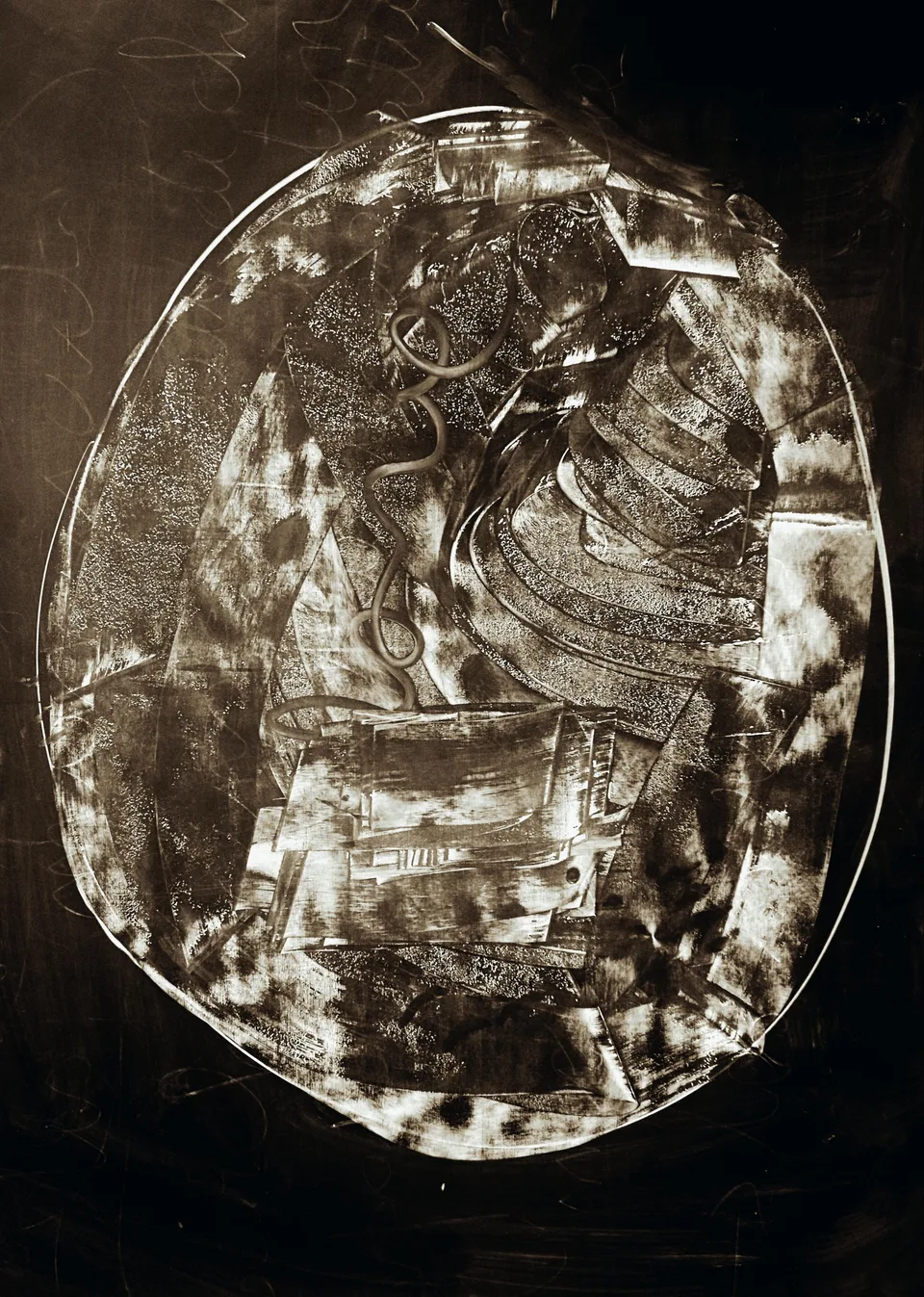 A dark oval monotype scratched through with white — figures barely emerging