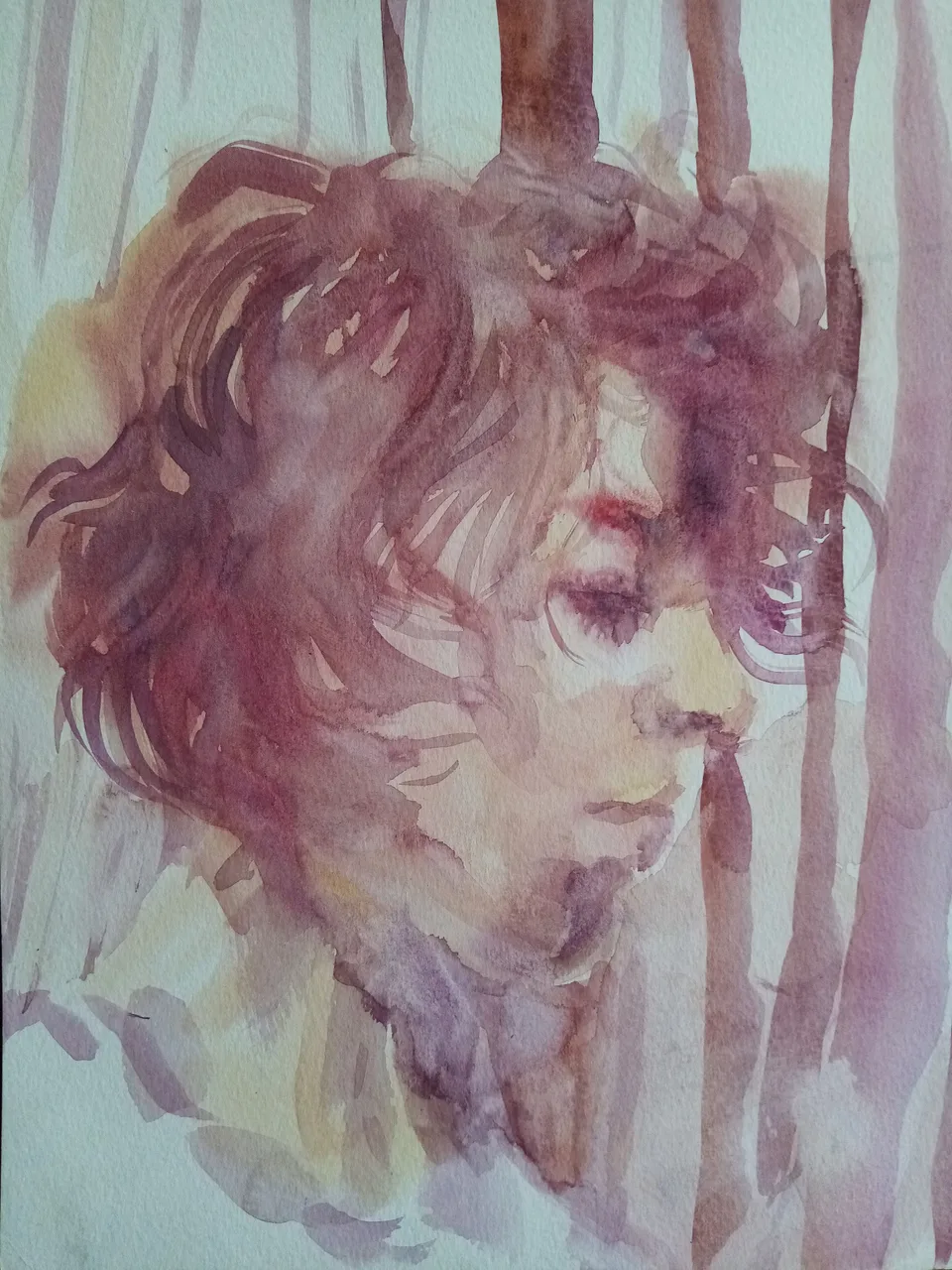 A head in profile in red watercolour, the colour running down the paper